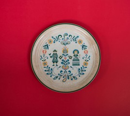 Empty plate European style on red background
