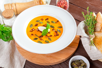Pumpkin soup in white plate