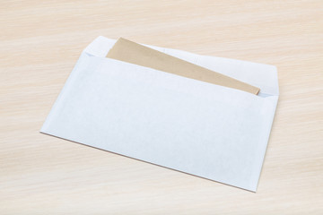Photo of blank envelope on a  wooden background