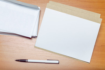 Photo of blank envelope on a  wooden background