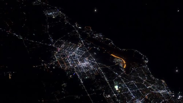 4K footage arial view of flying drone through the night light city scene