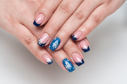 Christmas blue french manicure with white snowflakes