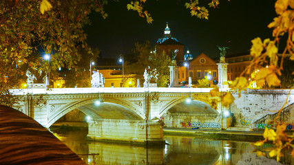 The illuminated bridges over River Tiber in Rome - great night view
