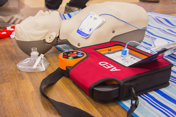 cpr with aed training and blur background - obrazy, fototapety, plakaty
