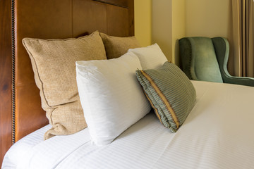 Hotel Room Bed Pillows and Chair