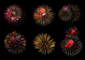 Collection of various colorful fireworks on black background