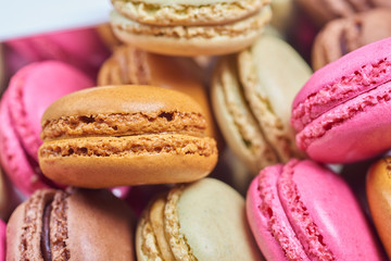 Colorful french macaroons in a box