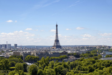 Aerial view of Eiffel tower and Paris cityscape. Iconic, wrought-iron 1889 structure, with steps...