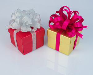 Gift boxes with ribbons isolated on white background