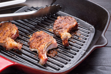 Fried lamb steak on grill pan