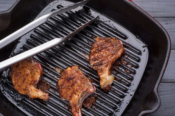 Fried lamb steak on grill pan