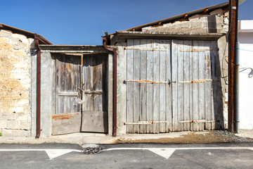 Old wooden facade doors in cypriot village Omodos.