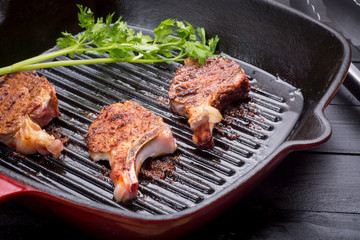 Fried lamb steak on grill pan