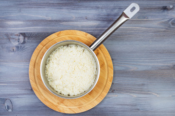Ingredients for cooking and empty cutting board on an old wooden table. Food background with copyspace