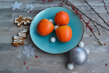 Christmas fruits on the blue plates