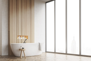 Corner of a bathroom, window, white and wooden