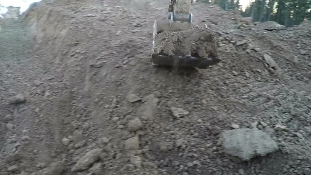 Excavator Digging soil POV. Excavator working at construction site zero cycle