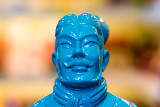 Blue terracotta warrior figure, closeup of head, selective focus