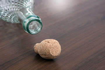 Champagne bottle cork on wooden table