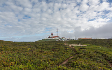 Fototapeta na wymiar Lighthouse on Cape Roca (Cabo da Roca), Sintra, Portugal.