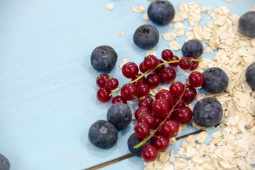 Naklejka na ściany i meble Healthy breakfast Fresh granola, muesli in bowl with milk and berries on a white background