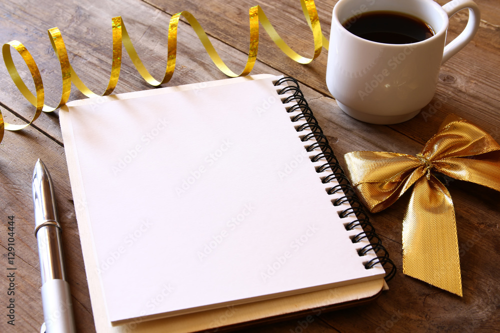 Poster top view image of open notebook with blank pages