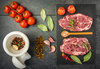 raw beef steak with spices top view