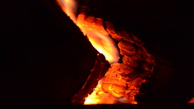 Logs burning in old stove