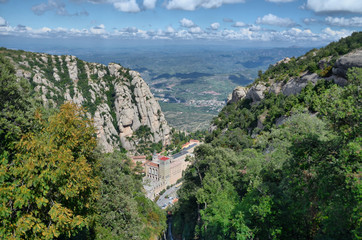 Fototapeta na wymiar Benedictine abbey Santa Maria de Montserrat on the mountain of Montserrat 
