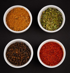 spices, seasonings on black background