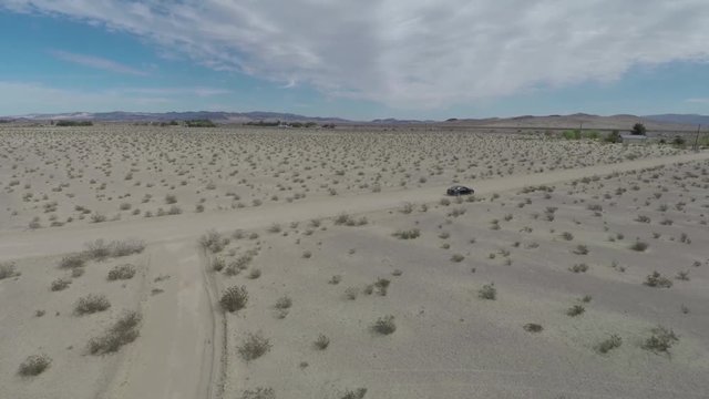 Car Driving Desert Road Black Lexus Aerial 2.mov