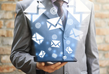 Businessman checking email. Concept of sending e-mails from your  tablet computer. Man dispatch...