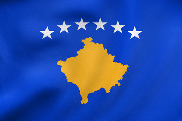 Flag of Kosovo waving, real fabric texture