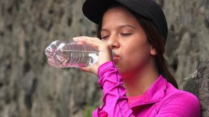 Thirsty Girl Drinking Bottled Water