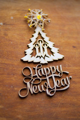 Wooden figures lie on a brown table