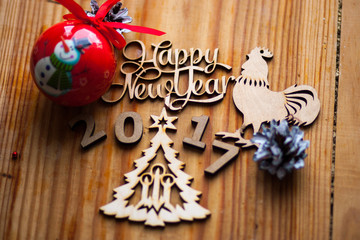 The composition of wooden figures on the table with decorations