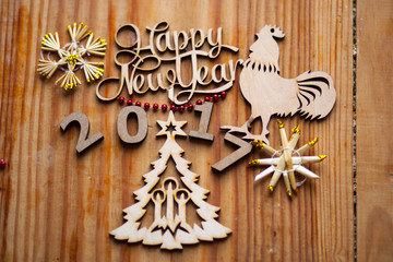 The composition of wooden figures on the table with decorations