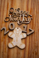 The composition of wooden figures on the table with decorations