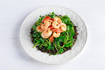 Fresh Healthy Prawns black rice salad on white plate