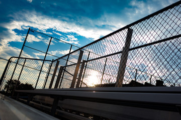 Chain Link Fence with Sunset - Bleacher Foreground