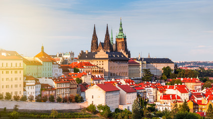 Fototapeta premium Evening summer Prague panorama from Old Town Bridge Tower with Charles Bridge, Prague Castle, Vltava river and historical architecture. Concept of Europe travel, sightseeing and tourism.