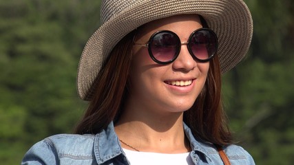 Fototapeta premium Teen Girl Sunny Day Wearing Sunglasses