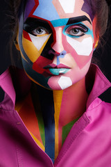 Model with a pop art makeup on her face © blackday