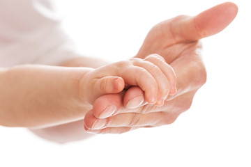 Baby holding father's hand