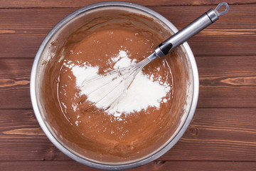 Wooden spoon and ingredients on dark background. Vegetarian food, health or cooking concept