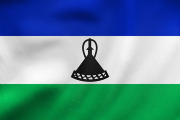 Flag of Lesotho waving, real fabric texture