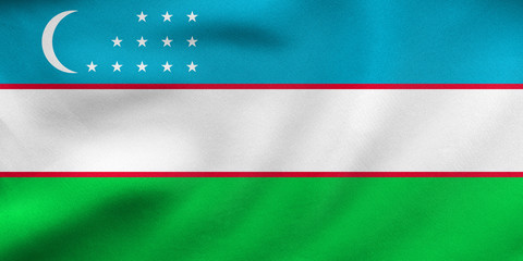 Flag of Uzbekistan waving, real fabric texture