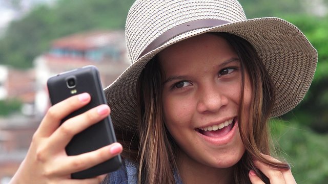 Adorable Teen Girl Making Selfies And Funny Faces