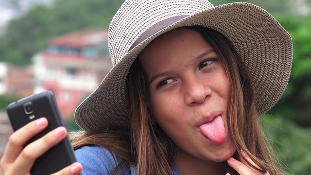 Adorable Teen Girl Making Selfies And Funny Faces