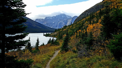 Autumn colors on a beautiful trail beside a mountain lake.